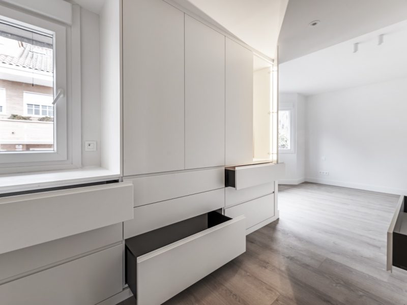 A dressing room in a recently renovated bedroom where at the moment there are only built-in wardrobes